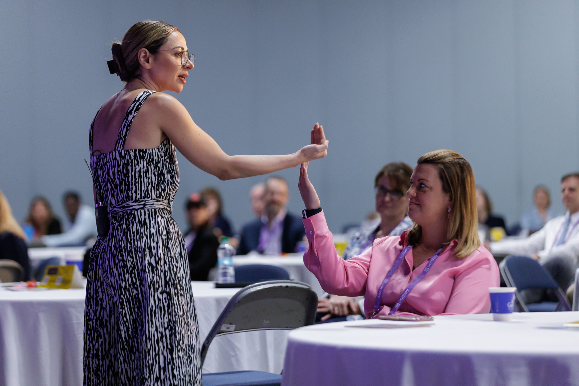 Keynote speaker addressing an attendee